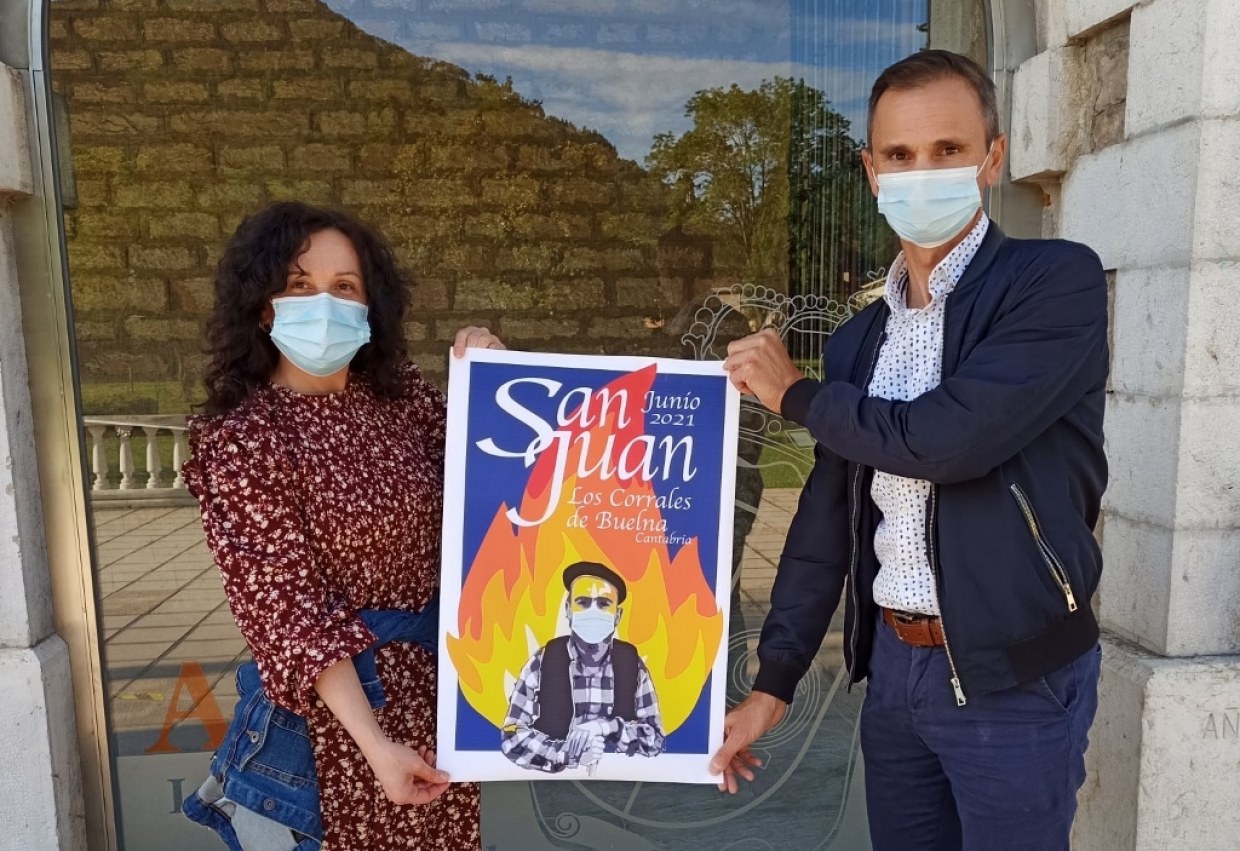 María Ángeles Lombilla y Javier Conde con el cartel de San Juan